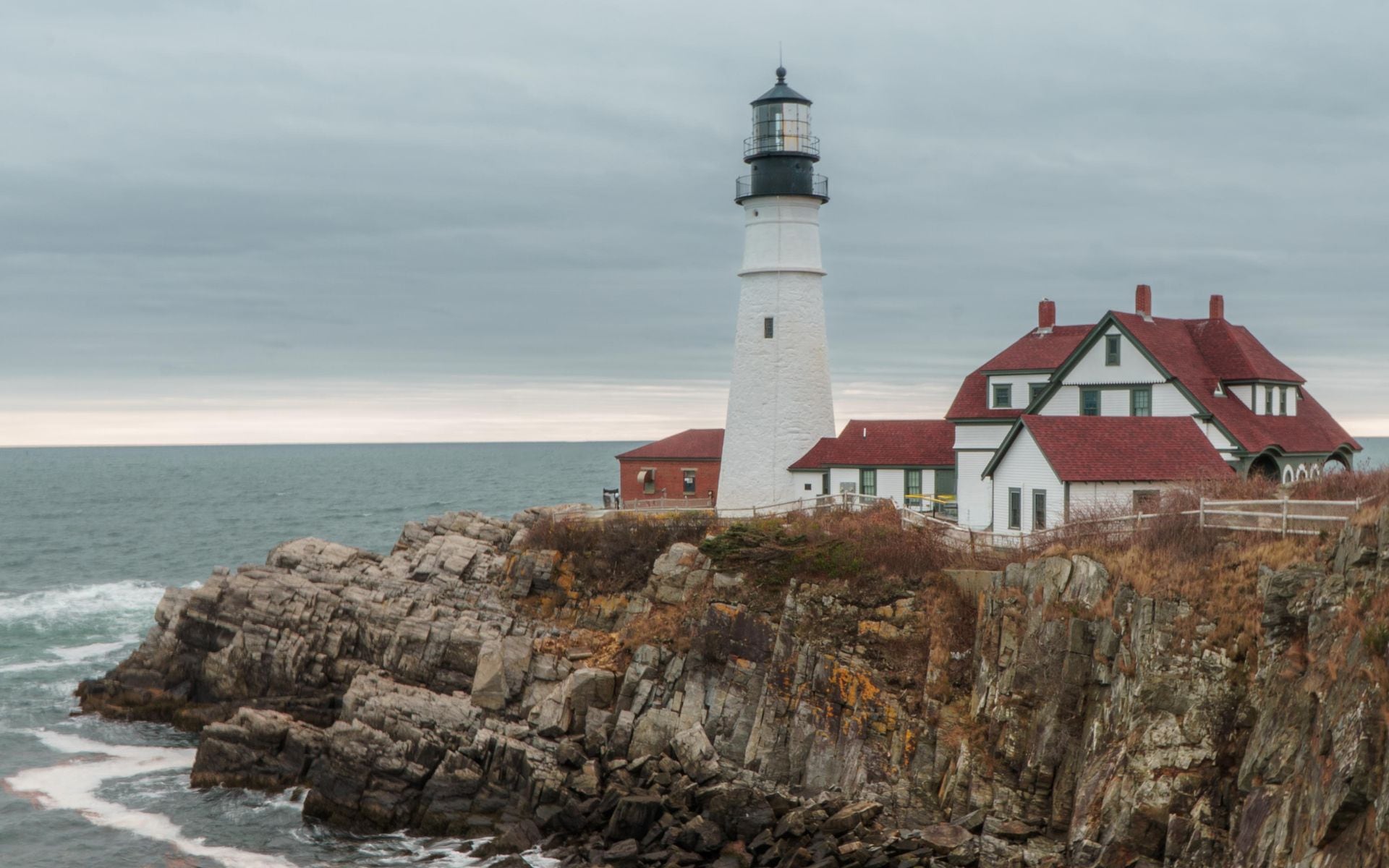 Portland Head Light on the granite headland at Fort Williams Park in Cape Elizabeth, Maine, above the Atlantic Ocean at dusk