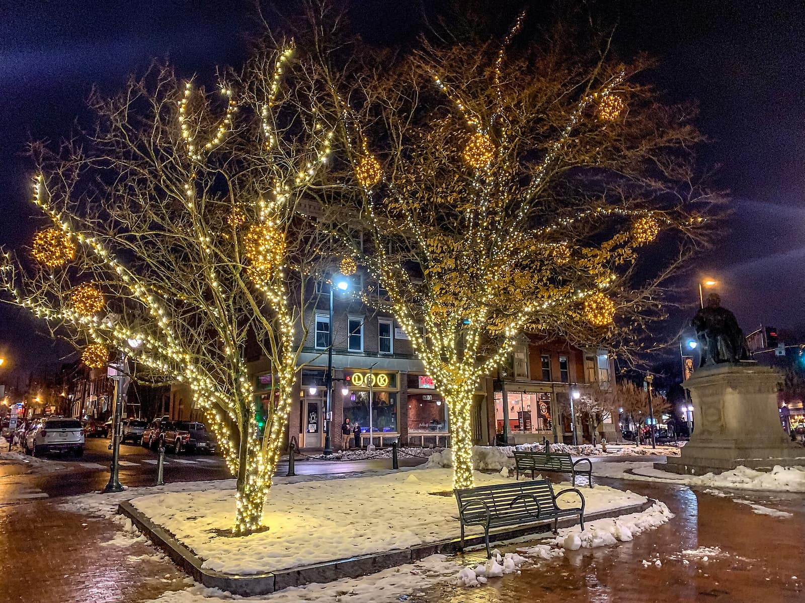 Longfellow Square in Portland, Maine lit with Christmas lights and a dusting of snow in winter