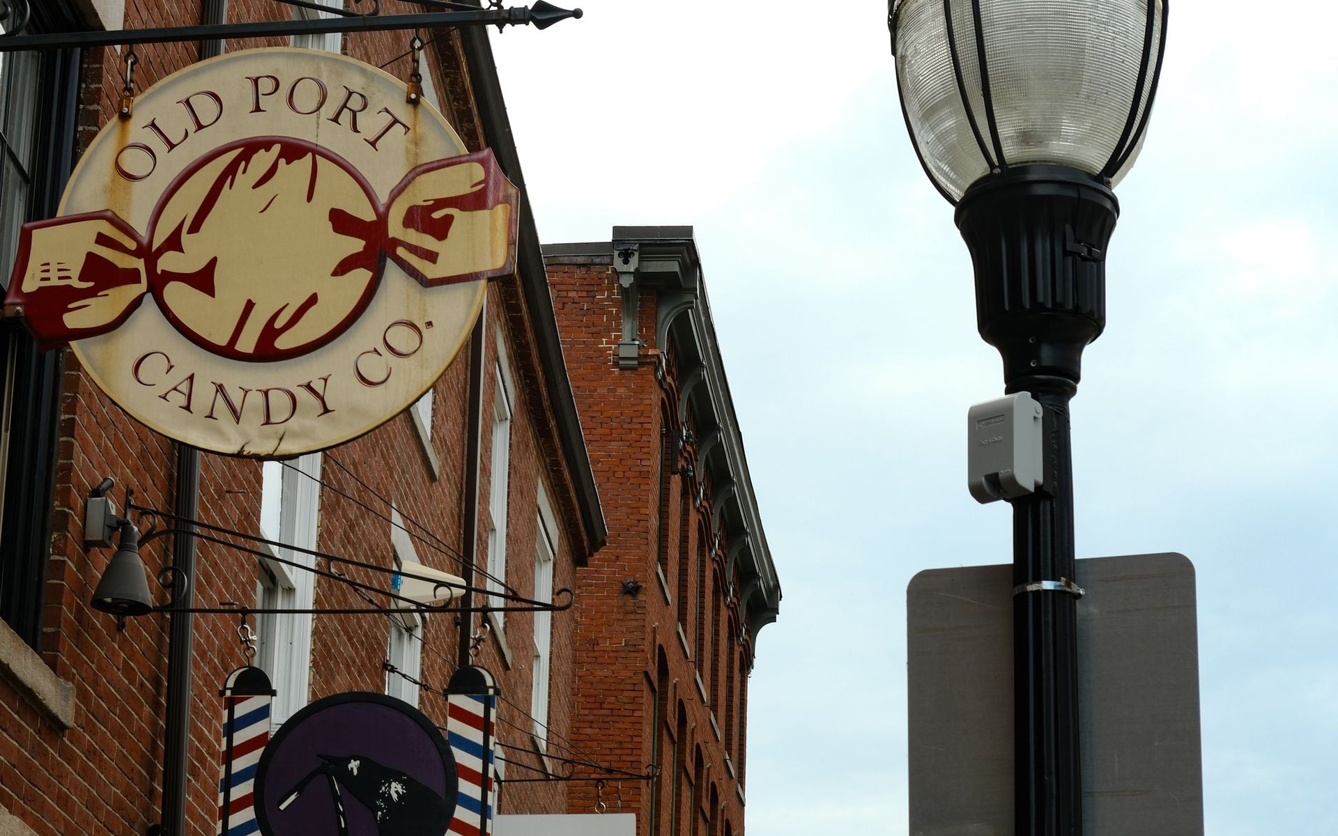 The cobblestone streets of Portland Maine's Old Port district with historic brick buildings along Exchange Street